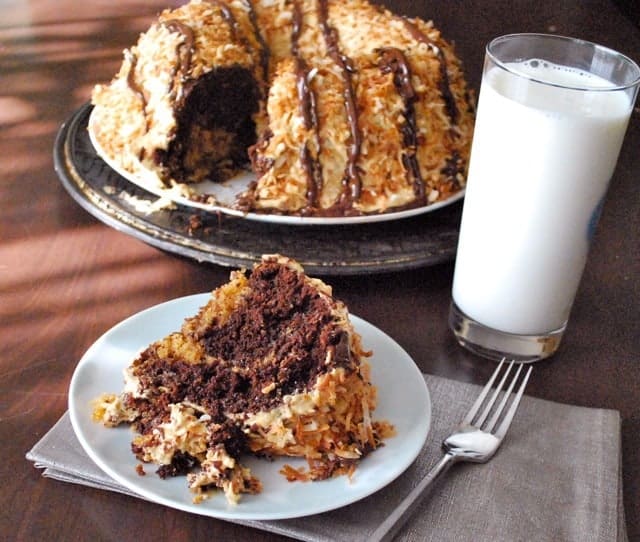 slice of samoa bundt cake with fork and milk 
