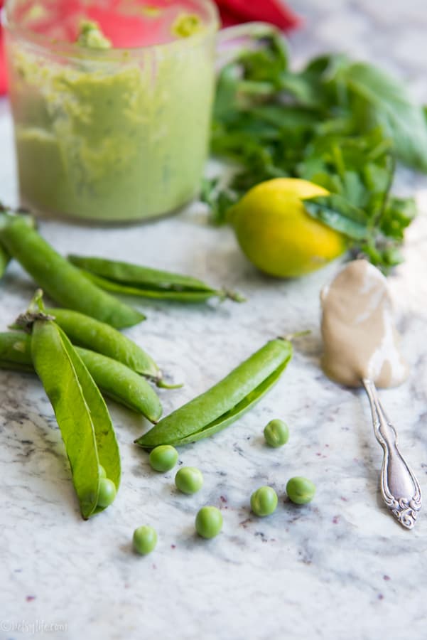 English peas, a spoonful of tahini, whole lemon and fresh herbs