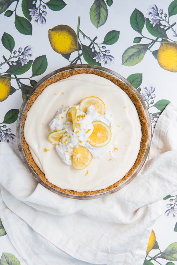 No bake lemon cool whip pie on a lemon printed background