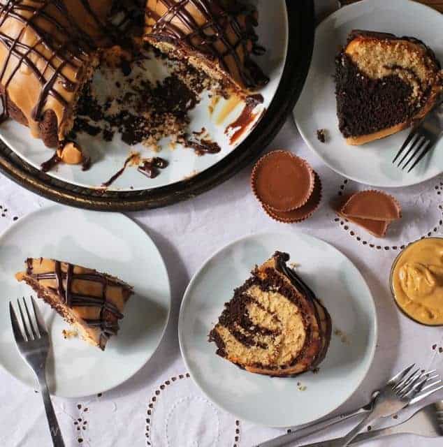 bird's eye view of chocolate swirl cake slices and cake on white tablecloth
