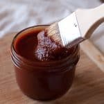 Easy bbq sauce recipe. Jar of homemade bbq sauce with a basting brush dipping in