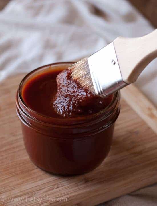 Easy bbq sauce recipe. Jar of homemade bbq sauce with a basting brush dipping in 