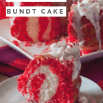 Peppermint Candy Bundt Cake with a slice removed on a plate. Inside of cake exposed to show a white and red swirl on the inside