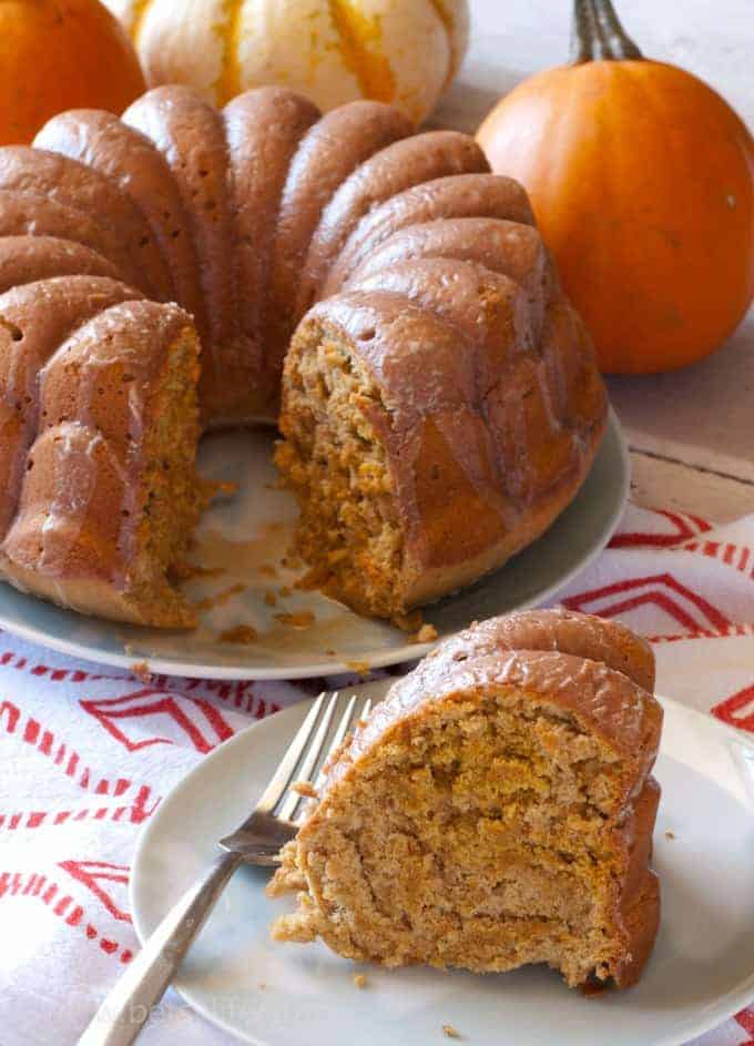 Pumpkin spice bundt cake with a slice on a plate with a fork