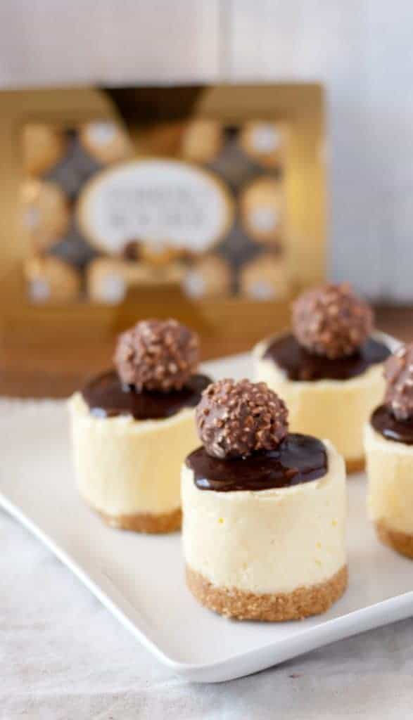Individual No Bake Cheesecakes with box of truffles in the background