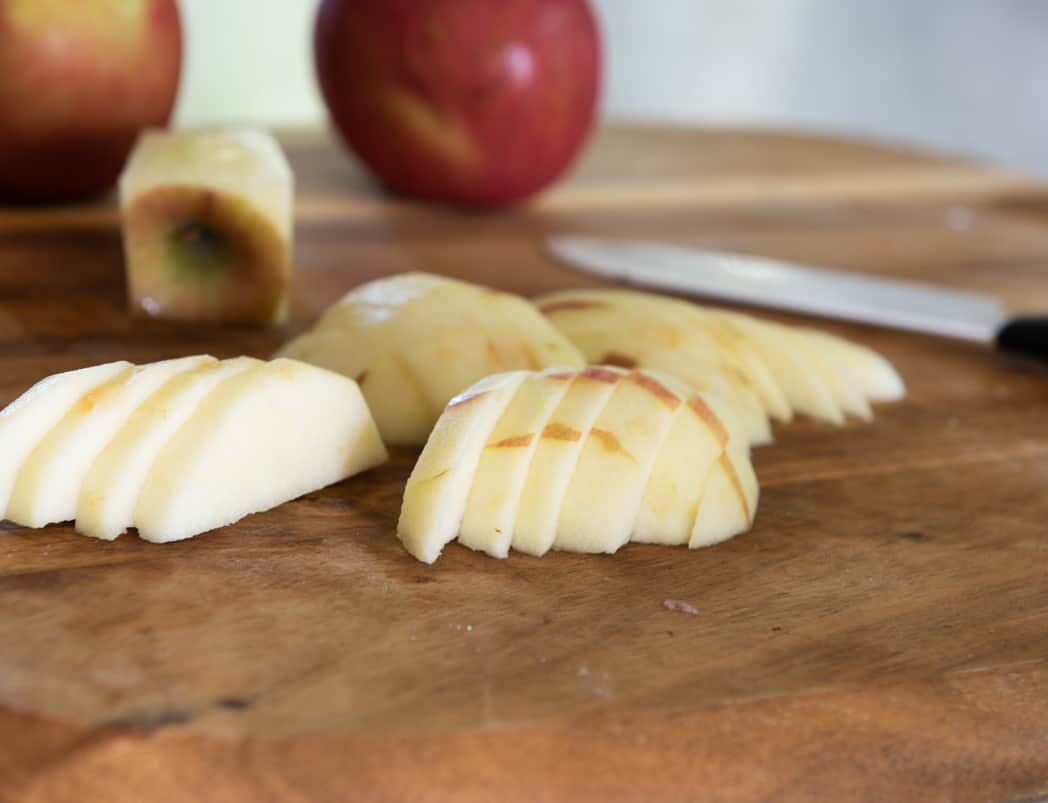 sliced apples on a cutting board