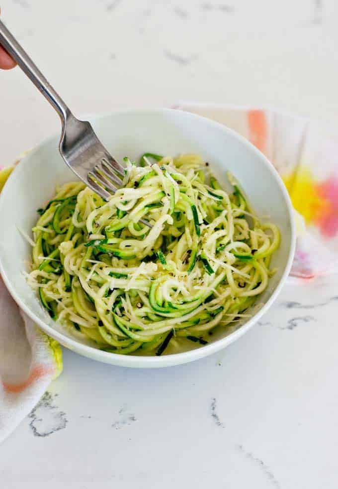 Spiralized zucchini pasta with a fork swirling a bite