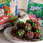 chocolate balls topped with red and green candy