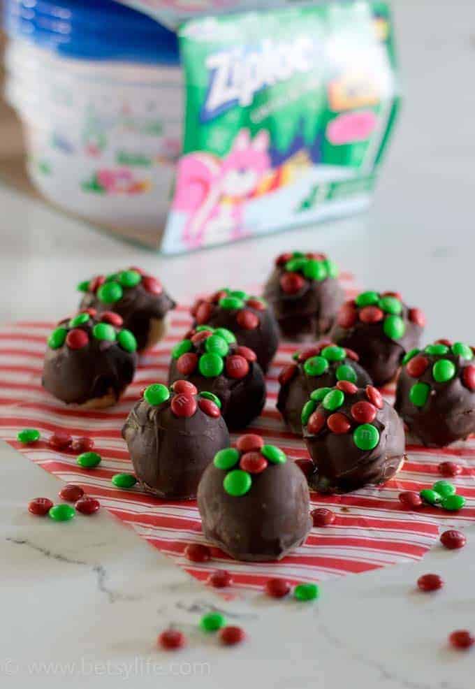chocolate balls topped with red and green candy