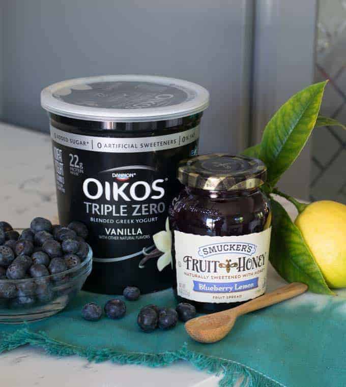 oikos triple zero yogurt and jar of smucker's jam